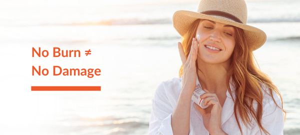 Woman outdoors applying 5% niacinamide cream for sun damage.